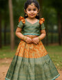 Peacock Green Zari Blouse with Rust-Orange Puff Sleeves Kids Lehenga Choli