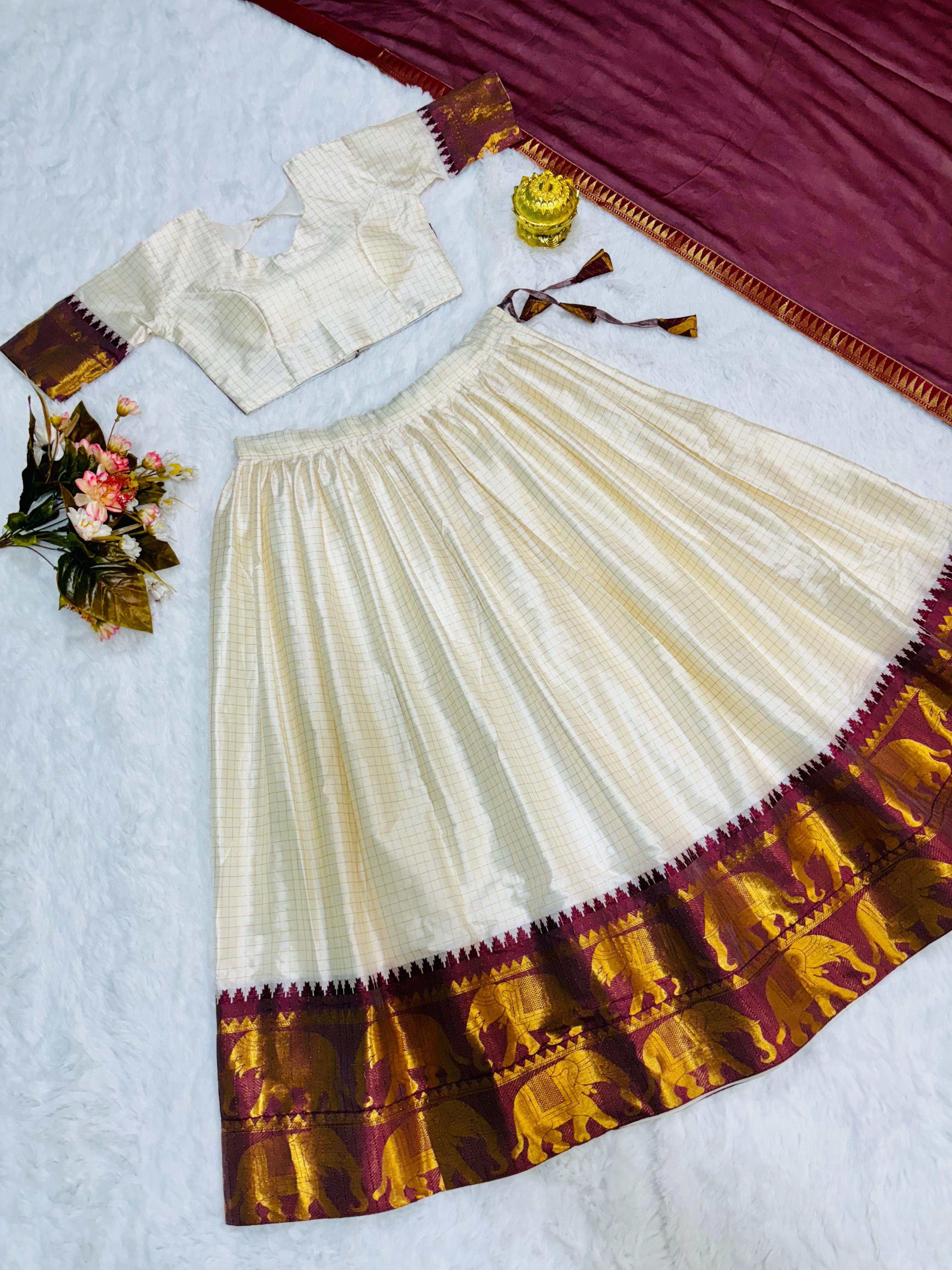 Elegant elephant white checks silk lehenga, light shades to complement to create beautiful aura in all function