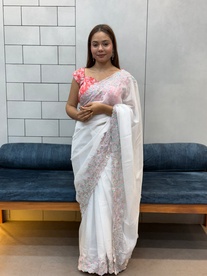 Elegant White tabby Organza Saree with Pastel Floral Embroidery & Pink Printed Blouse