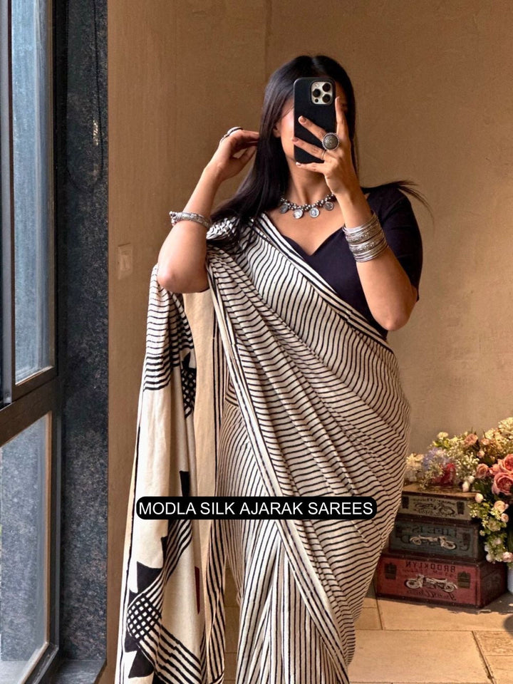 Ivory White & Black Modal Silk Contemporary Ajrakh Saree with Geometric Stripe Pattern, Artistic Statement Pallu & Tassel Detailing