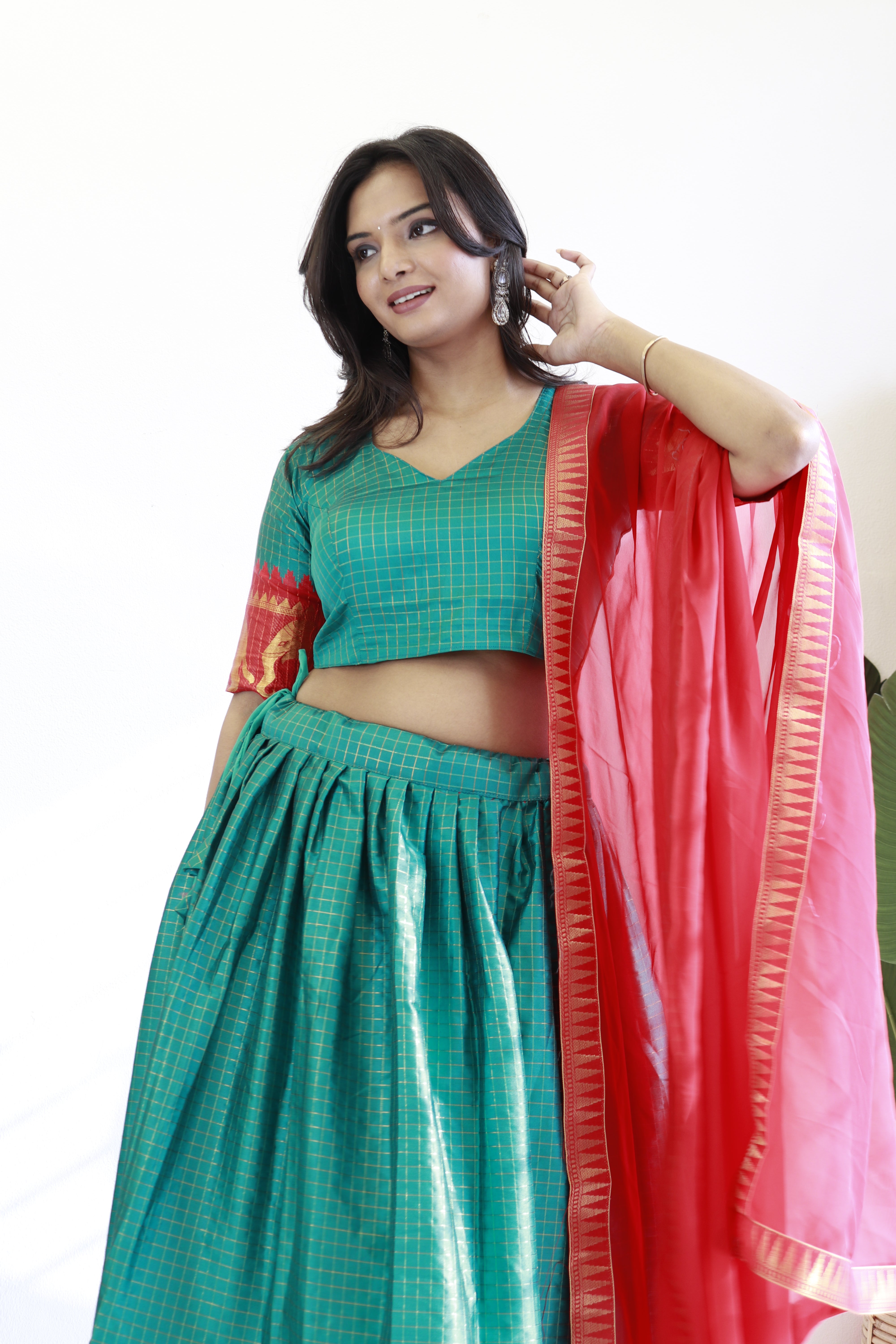 Elegant elephant green checks silk lehenga, light shades to complement to create beautiful aura in all function