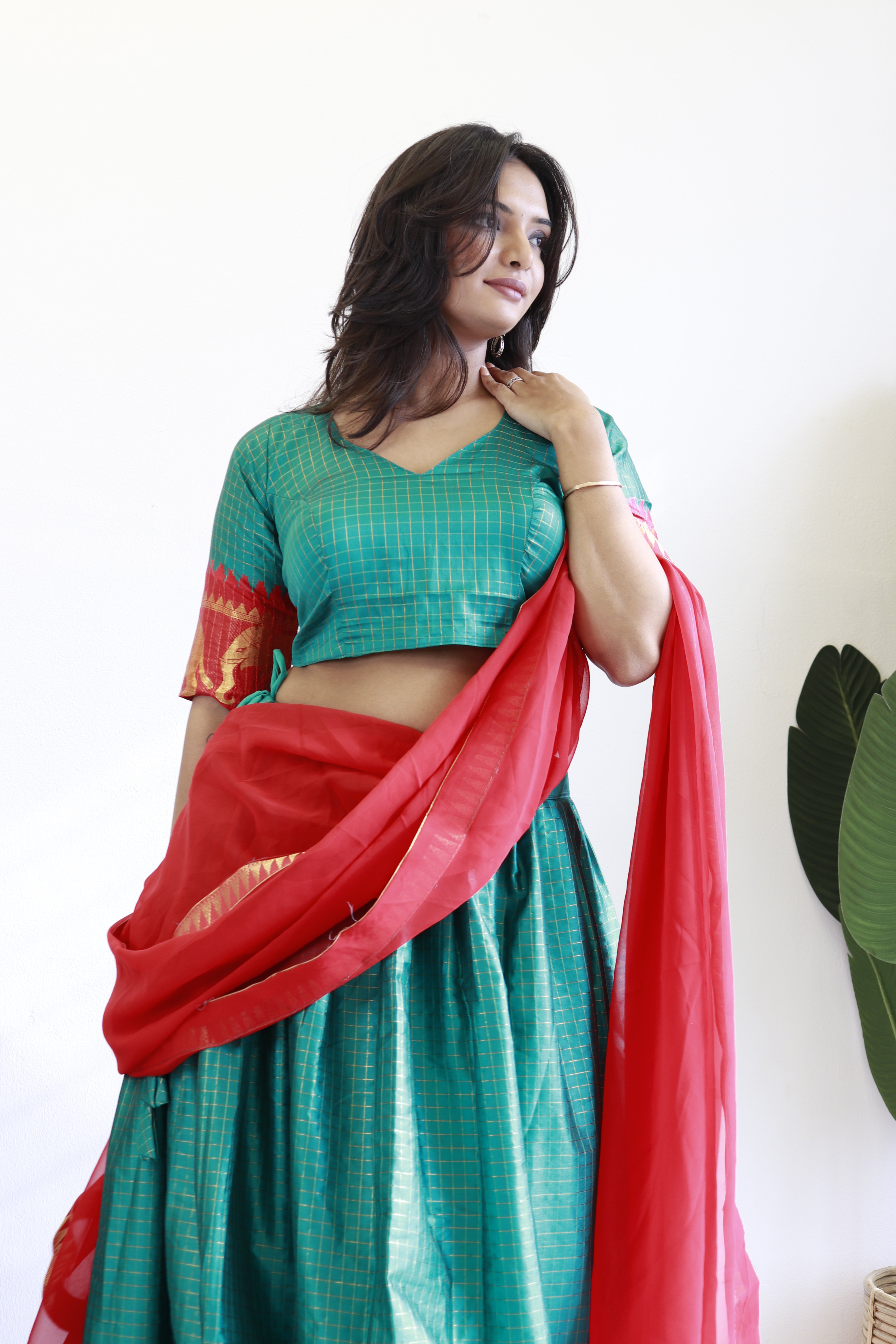 Elegant elephant green checks silk lehenga, light shades to complement to create beautiful aura in all function