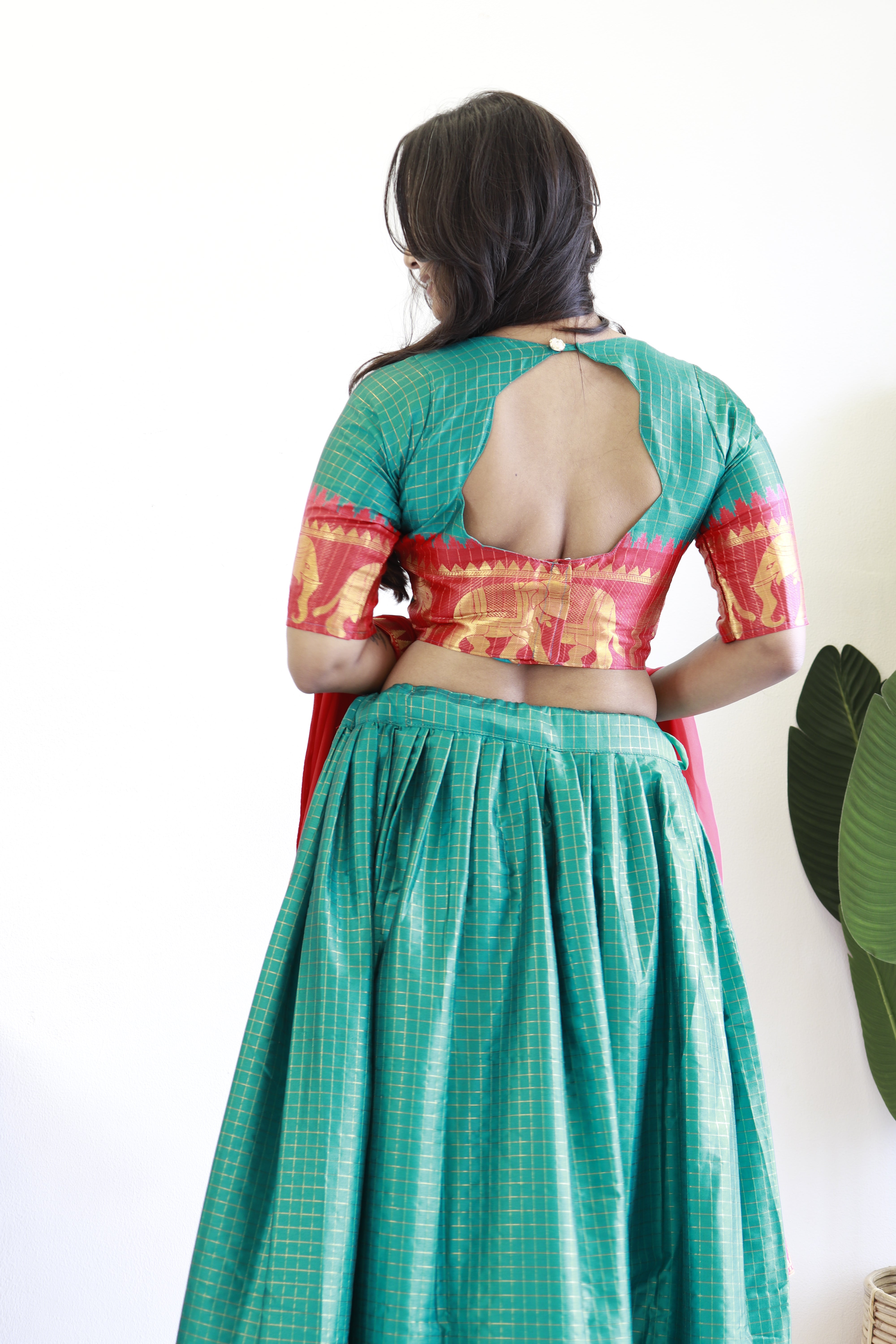 Elegant elephant green checks silk lehenga, light shades to complement to create beautiful aura in all function