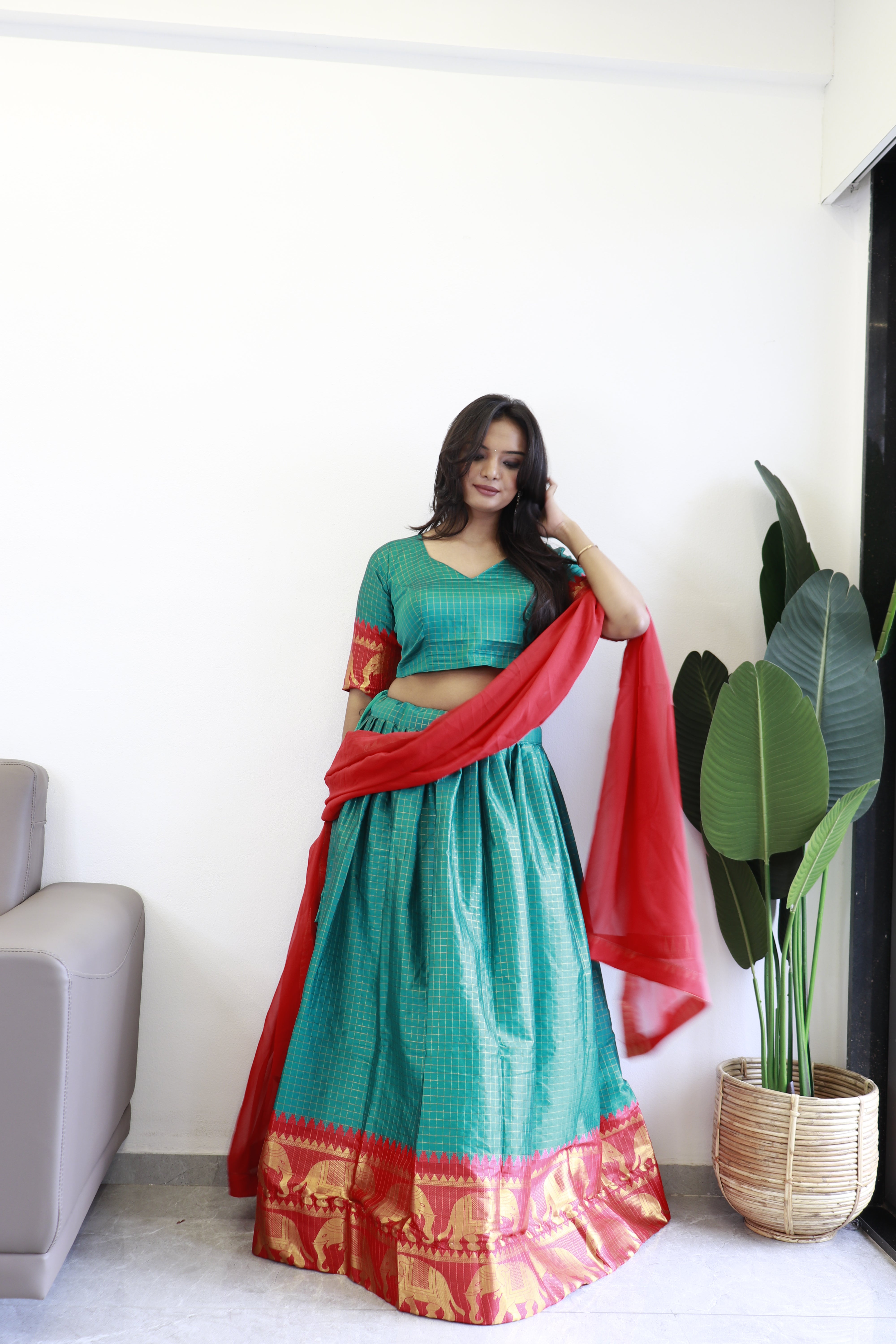 Elegant elephant green checks silk lehenga, light shades to complement to create beautiful aura in all function