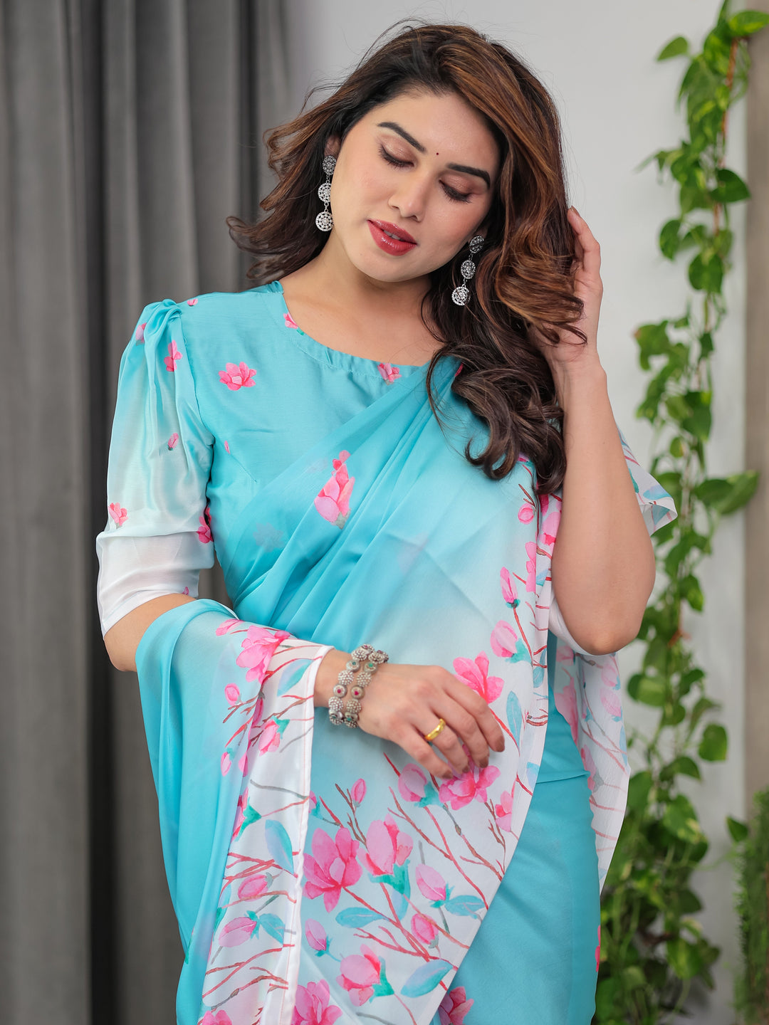Aqua Blue Satin Georgette Pink Floral Printed Saree with Attached Blouse – Soft Pastel Designer Saree for Elegant & Festive Wear