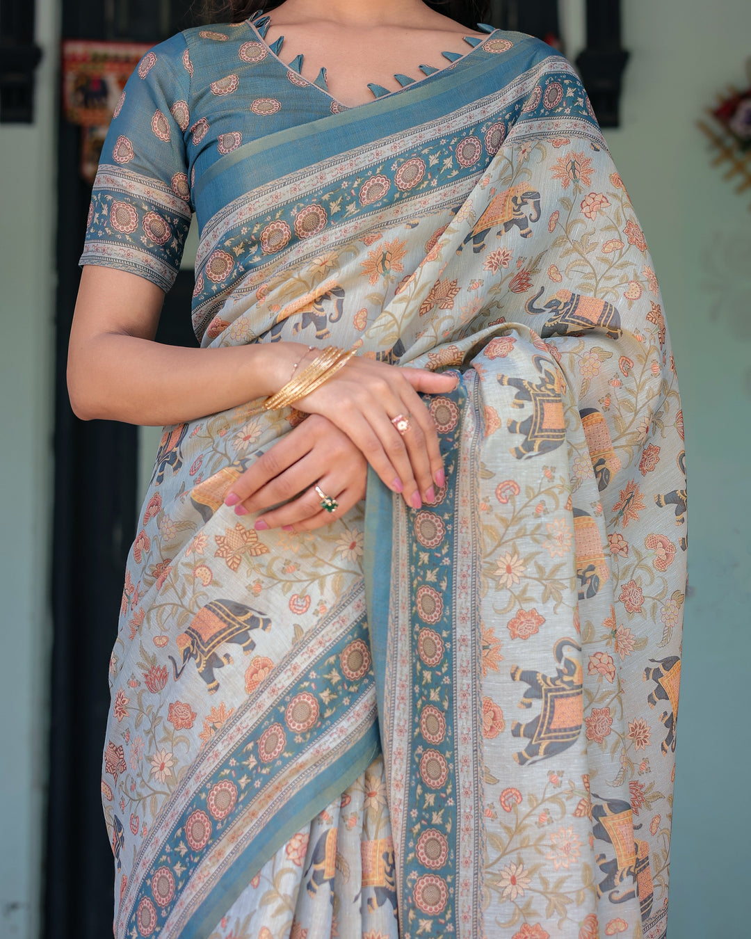 Icy Blue Handloom Cotton Saree with Peach Elephant Motifs & Royal Procession Pallu
