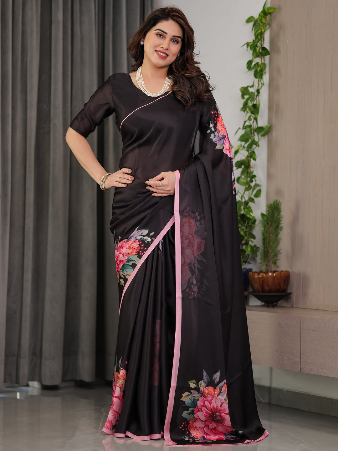 Black Satin Georgette Floral Printed Saree with Soft Pink Border & Attached Blouse – Elegant Designer Partywear Drape