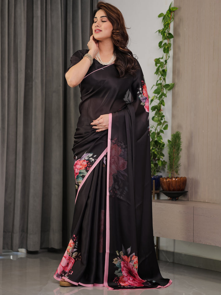 Black Satin Georgette Floral Printed Saree with Soft Pink Border & Attached Blouse – Elegant Designer Partywear Drape
