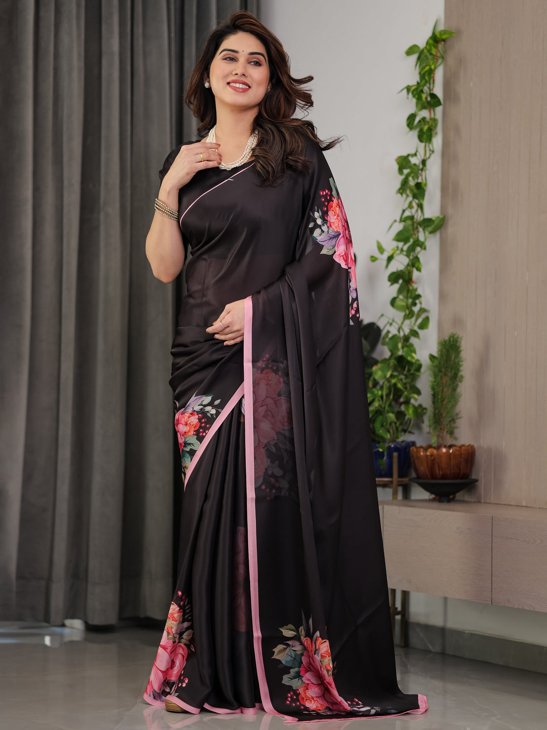 Black Satin Georgette Floral Printed Saree with Soft Pink Border & Attached Blouse – Elegant Designer Partywear Drape