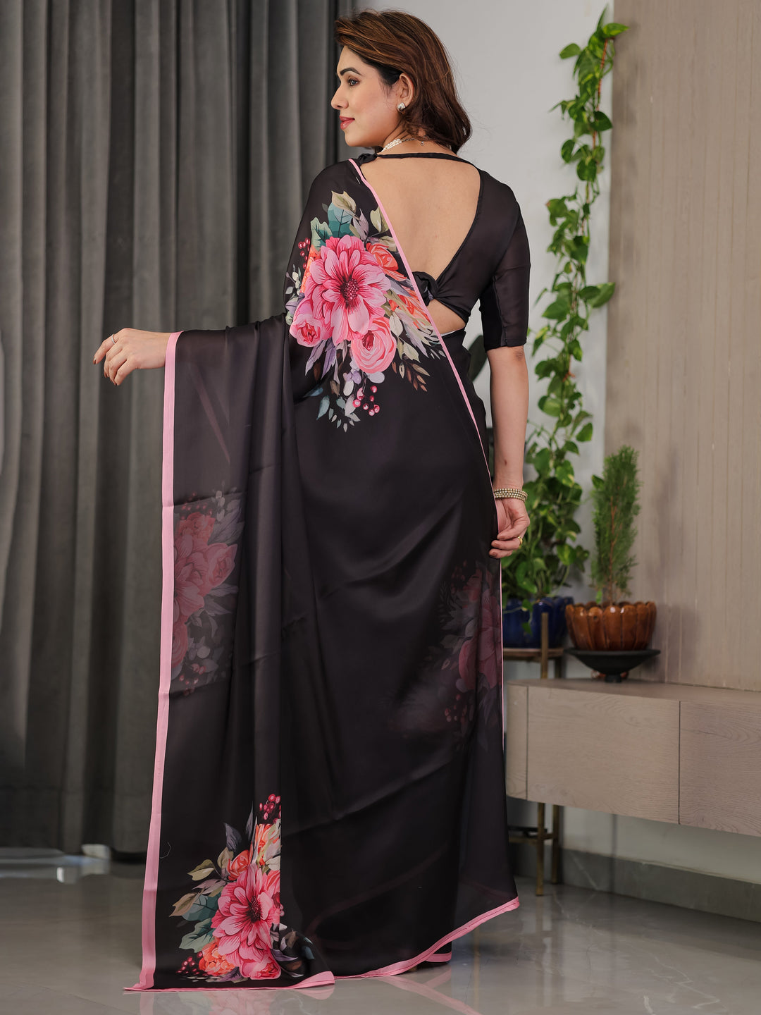 Black Satin Georgette Floral Printed Saree with Soft Pink Border & Attached Blouse – Elegant Designer Partywear Drape