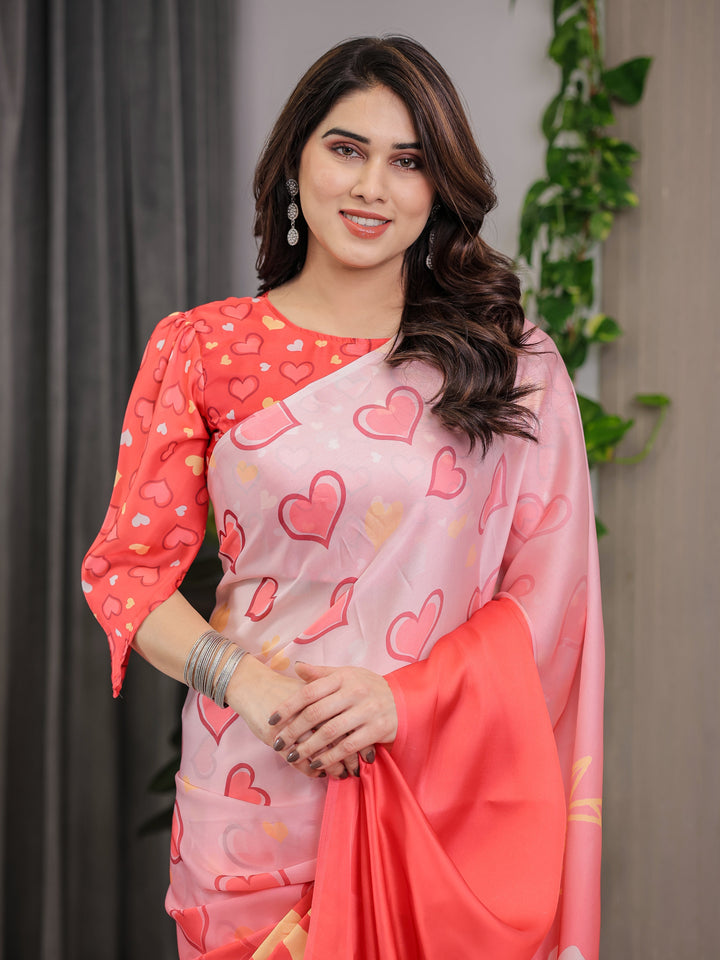 Coral Red & Blush Pink Heart Printed Satin Georgette Saree with Romantic Couple Pallu and Attached Heart Print Blouse – 5.5 Meter Designer Saree for Valentine’s Day & Anniversary Wear