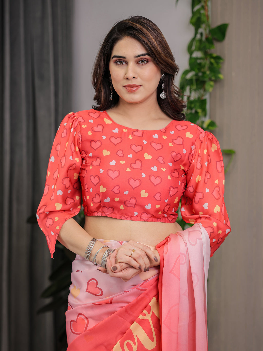 Coral Red & Blush Pink Heart Printed Satin Georgette Saree with Romantic Couple Pallu and Attached Heart Print Blouse – 5.5 Meter Designer Saree for Valentine’s Day & Anniversary Wear