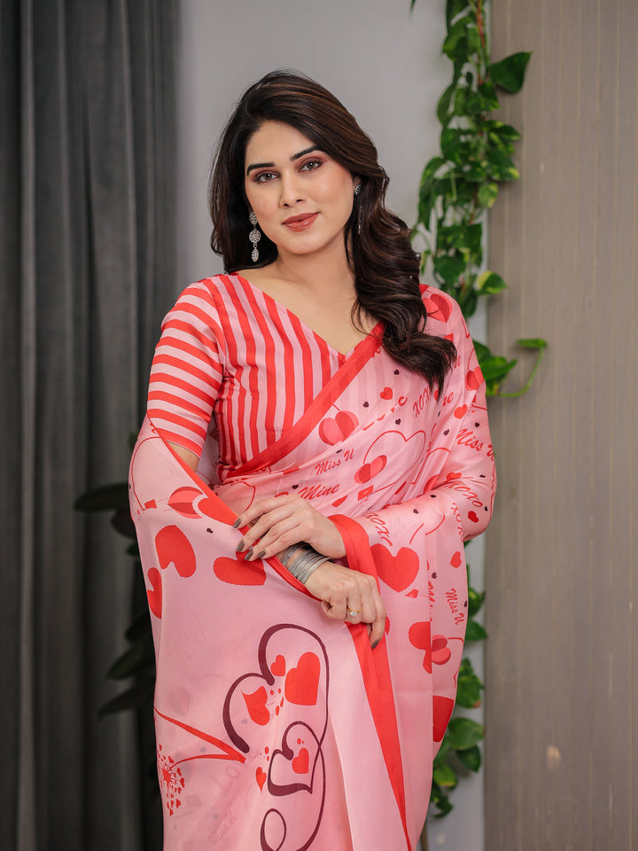 Blush Pink & Coral Red Heart Print Satin Georgette Saree with Romantic Love Typography Pallu and Attached Striped Blouse – 5.5 Meter Designer Saree for Valentine’s Day & Anniversary Wear