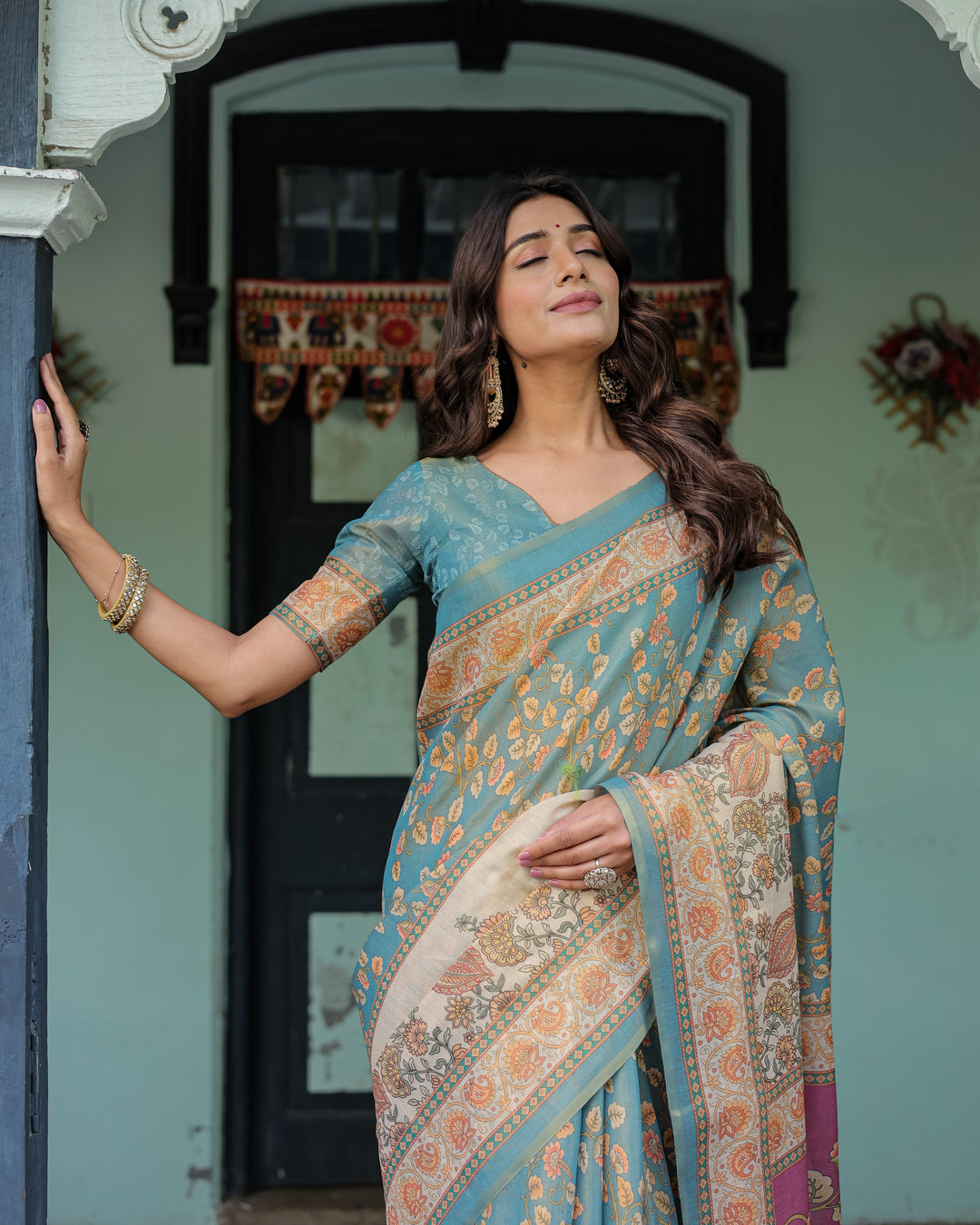 Turquoise Blue Handloom Cotton Saree with Multicolor Floral Pallu & Peach Border