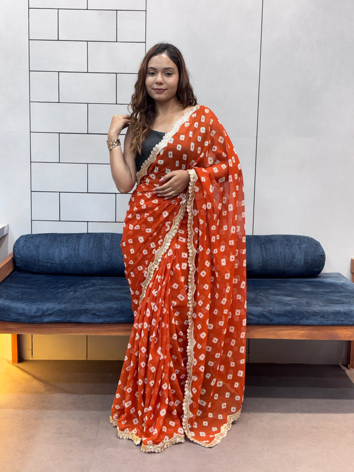 Vibrant Orange Bandhani Georgette Saree with embroidery  Lace Border & Running Blouse