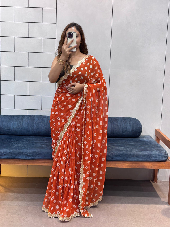 Vibrant Orange Bandhani Georgette Saree with embroidery  Lace Border & Running Blouse