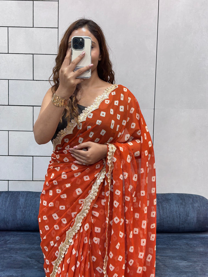 Vibrant Orange Bandhani Georgette Saree with embroidery  Lace Border & Running Blouse