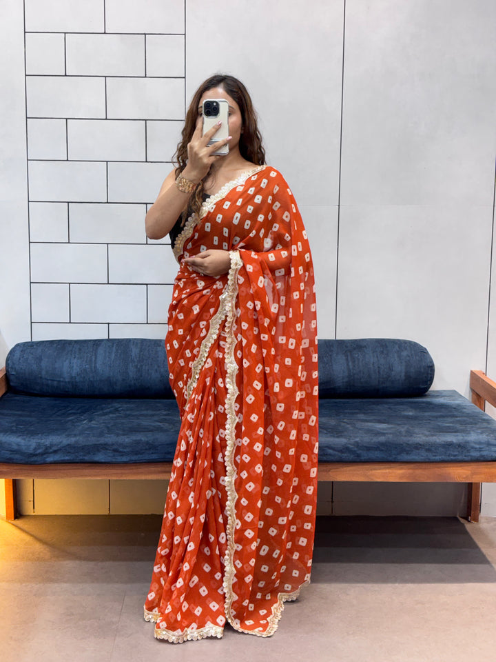 Vibrant Orange Bandhani Georgette Saree with embroidery  Lace Border & Running Blouse