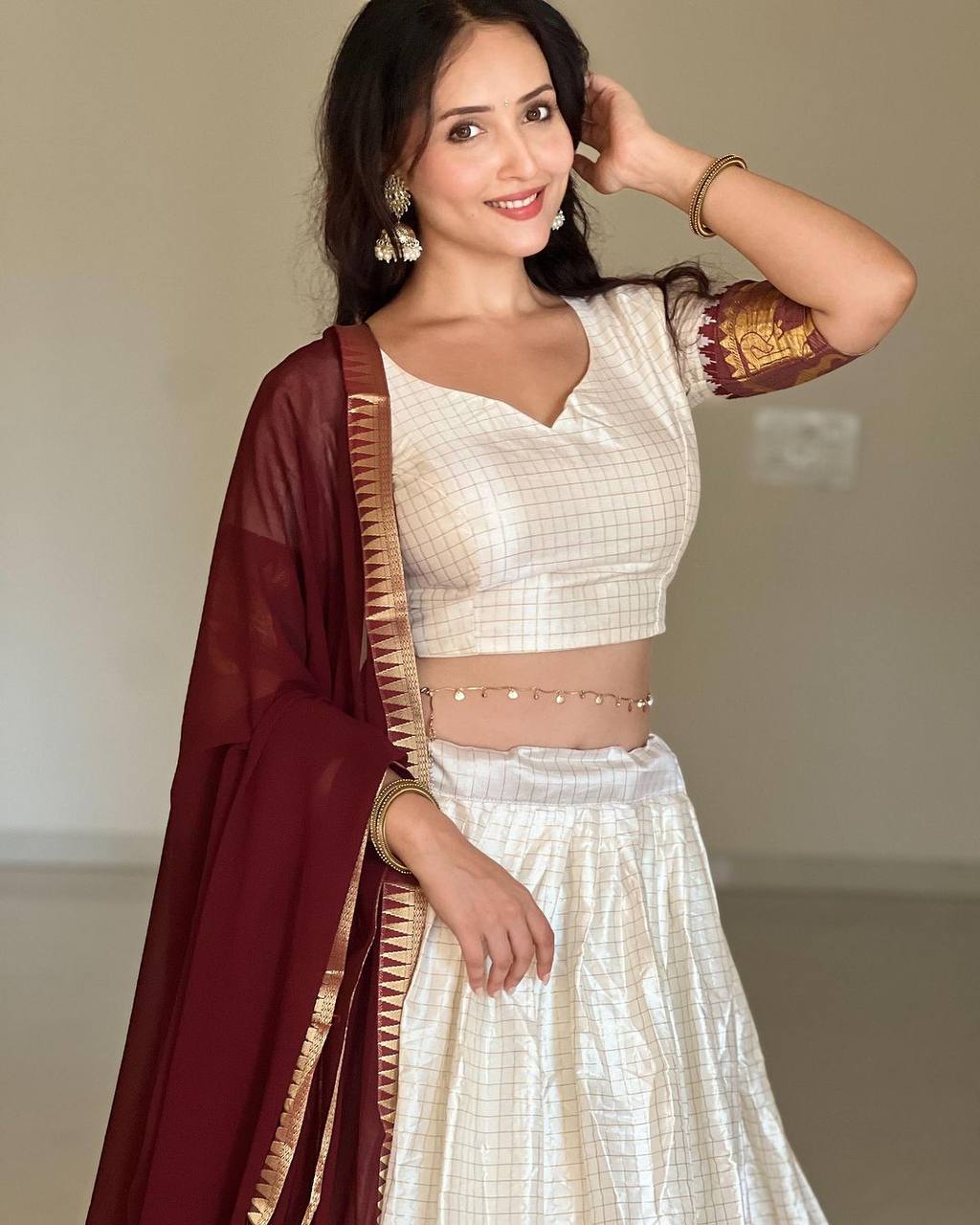 Elegant elephant white checks silk lehenga, light shades to complement to create beautiful aura in all function