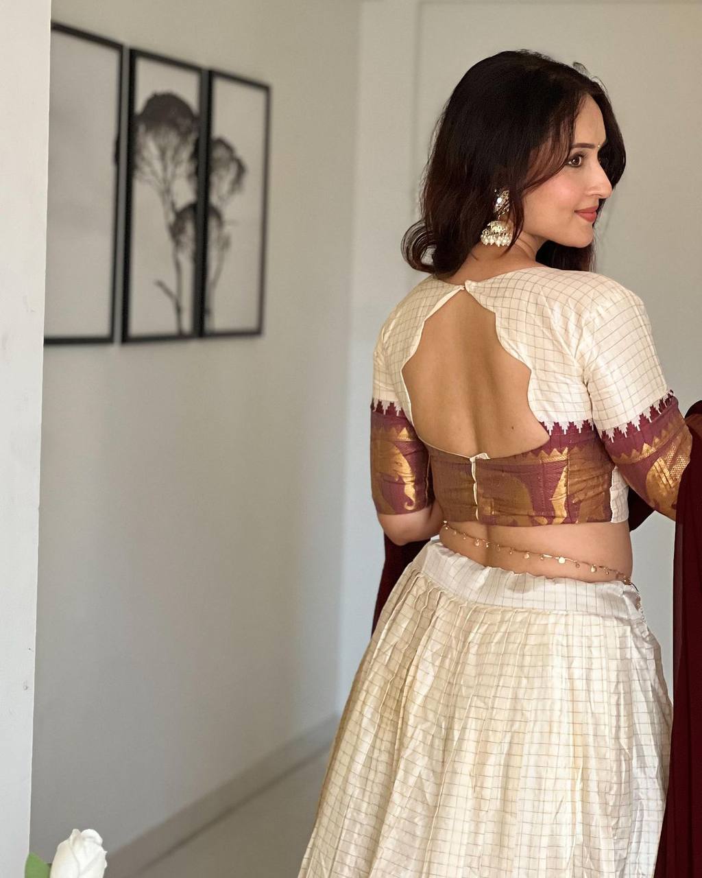 Elegant elephant white checks silk lehenga, light shades to complement to create beautiful aura in all function