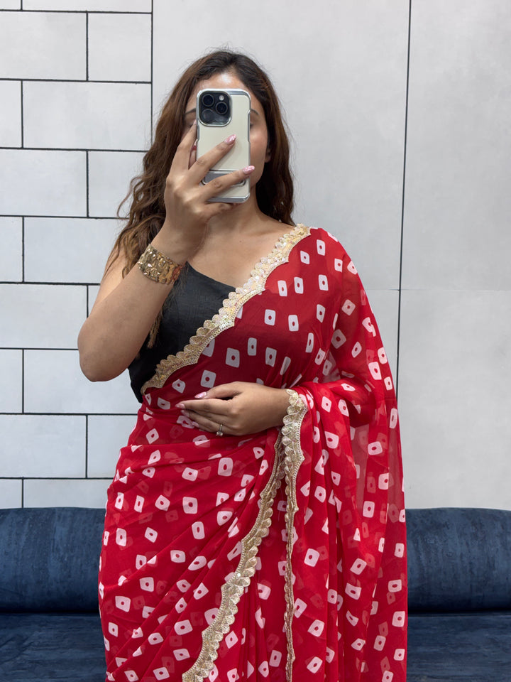 Crimson Red Bandhani Georgette Saree with embroidery Lace Border & Running Blouse