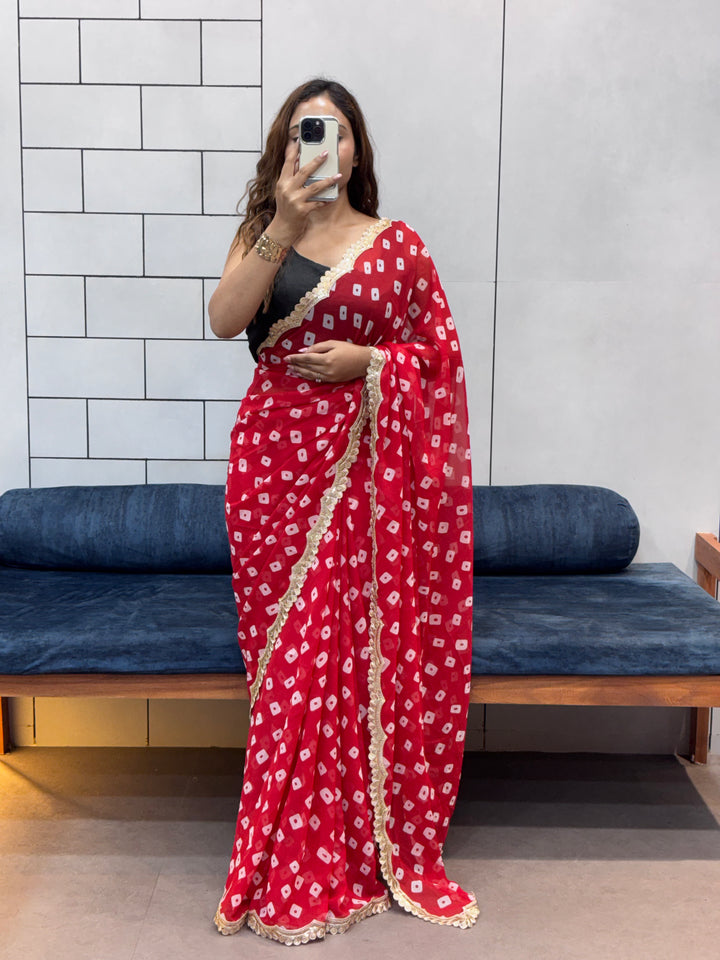 Crimson Red Bandhani Georgette Saree with embroidery Lace Border & Running Blouse